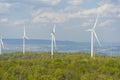 A Wind turbines farm on the hill. Alternative energy source. Royalty Free Stock Photo