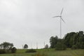 Wind turbines field in a stormy day with strong wind and rain. Wind farm eco field. Green ecological power Royalty Free Stock Photo