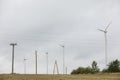 Wind turbines field in a stormy day with strong wind and rain. Wind farm eco field. Green ecological power Royalty Free Stock Photo