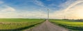 The wind turbines on the field in sunsetlight Royalty Free Stock Photo