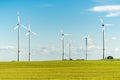 Wind turbines at a field - windmills on a sunny day