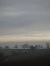 Wind turbines floating in the mist Royalty Free Stock Photo