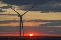 Wind turbines that generate electricity. Eco-friendly electricity. Sunset Royalty Free Stock Photo