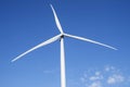 Wind turbines generating electricity with blue sky. Close up of Wind turbine producing alternative energy Royalty Free Stock Photo