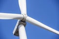 Wind turbines generating electricity with blue sky. Close up of Wind turbine producing alternative energy Royalty Free Stock Photo