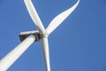 Wind turbines generating electricity with blue sky. Close up of Wind turbine producing alternative energy Royalty Free Stock Photo