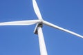 Wind turbines generating electricity with blue sky. Close up of Wind turbine producing alternative energy Royalty Free Stock Photo