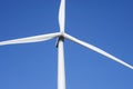 Wind turbines generating electricity with blue sky. Close up of Wind turbine producing alternative energy Royalty Free Stock Photo