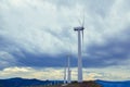 Wind turbines. Wind generators. Wind turbine generators. Alternative energy. Windmills over dramatic cloudy sky. Industrial Royalty Free Stock Photo