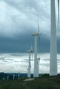 Wind turbines. Wind generators. Wind turbine generators. Alternative energy. Windmills over dramatic cloudy sky. Industrial Royalty Free Stock Photo