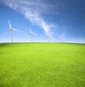 Wind turbines in an green field Royalty Free Stock Photo