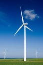 Wind turbines in green field Royalty Free Stock Photo