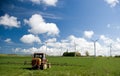 Wind turbines in green field Royalty Free Stock Photo