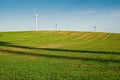 Wind turbines green field Royalty Free Stock Photo