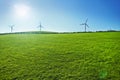 Wind turbines on a green field. Green energy