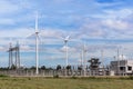 Wind turbines with high voltage electrical power pylon substation for renewable wind energy Royalty Free Stock Photo