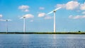 Wind Turbines, the modern Windmills, in a Wind Farm along the Shore of Veluwemeer Royalty Free Stock Photo