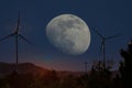 Wind turbines in moonlight in a landscape with clear skies
