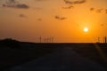 Wind turbines at orange sunset in the rural of Corpus Christi, Texas, USA Royalty Free Stock Photo