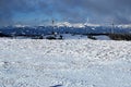 Wind turbines with peaks on the background in winter Austrian Alps Royalty Free Stock Photo