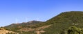 Wind turbines in the plain in the hills. Royalty Free Stock Photo