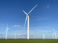 Wind turbines that produce electricity energy. Windmill Wind power technology productions Wind turbines in field