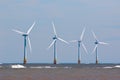 Wind turbines at sea Renewable energy offshore windfarm Royalty Free Stock Photo