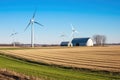 wind turbines shadow casting over the farm field Royalty Free Stock Photo