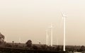 Wind turbines on sky in sepia color filter