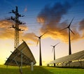 Wind turbines with solar energy panel and electricity transmission pylon. Royalty Free Stock Photo