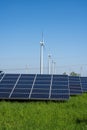 Wind turbines, solar panels and power lines Royalty Free Stock Photo