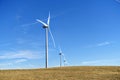 Wind turbines sprawled across the vast farm land of Alberta, Canada.