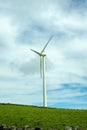 Wind turbines stand tall against a cloudy sky on Terceira Island, Azores. Royalty Free Stock Photo