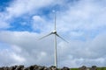 Wind turbines stand tall against a cloudy sky on Terceira Island, Azores. Royalty Free Stock Photo