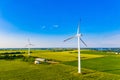 Wind turbines in summer fields, colorful aerial landscape. Alternative energy concept Royalty Free Stock Photo