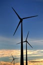 Wind turbines at sunset. Royalty Free Stock Photo