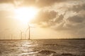 Wind turbines at sunset. Ecology wind against cloudy sky background with copy space Royalty Free Stock Photo