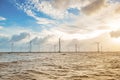 Wind turbines at sunset. Ecology wind against cloudy sky background with copy space Royalty Free Stock Photo