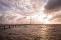 Wind turbines at sunset. Ecology wind against cloudy sky background with copy space Royalty Free Stock Photo