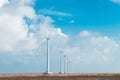 Wind turbines at sunset. Ecology wind against cloudy sky background with copy space Royalty Free Stock Photo