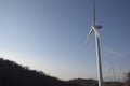 Wind turbines at sunset Production of alternative energy and conservation of the environment. Trentino, Italy Royalty Free Stock Photo