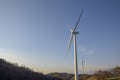 Wind turbines at sunset. Production of clean and renewable energy. Trentino, Italy Royalty Free Stock Photo