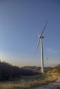 Wind turbines at sunset. Production of clean and renewable energy. Trentino, Italy Royalty Free Stock Photo