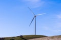 Wind turbines on the top of green hills Royalty Free Stock Photo