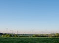 wind turbines under blue sky in german saarland in spring Royalty Free Stock Photo