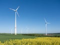 wind turbines under blue sky in german saarland in spring Royalty Free Stock Photo