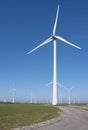 wind turbines under blue sky on philipsdam in dutch province of Zeeland Royalty Free Stock Photo