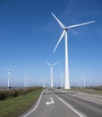 wind turbines under blue sky on philipsdam in dutch province of Zeeland Royalty Free Stock Photo