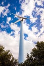 Wind turbines viewed from below help decontaminate the air Royalty Free Stock Photo