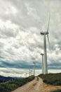 Wind turbines. Wind generators. Wind turbine generators. Alternative energy. Windmills over dramatic cloudy sky. Industrial Royalty Free Stock Photo
